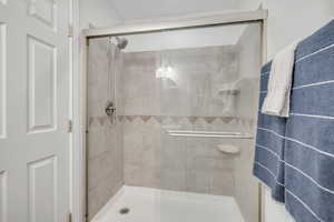 Full bathroom with a shower stall