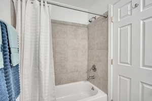 Full bathroom with shower / bath combo
