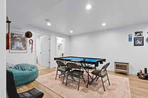 Game room featuring wood finished floors, baseboards, and recessed lighting
