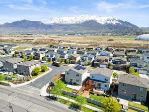 Birds eye view of property with a mountain view and a residential view