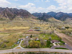 Birds eye view of property featuring a mountain view and a rural view
