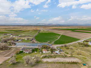 Aerial view featuring a rural view and a water and mountain view