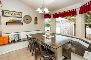 Dining room with built-in table and bench seating with storage