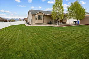 Rear view of house with a patio area