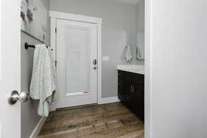 Bathroom featuring wood finished floors and vanity