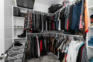 Walk in closet featuring carpet floors