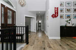 Foyer with a chandelier and light wood-style floors