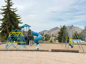 Community playground featuring a mountain view
