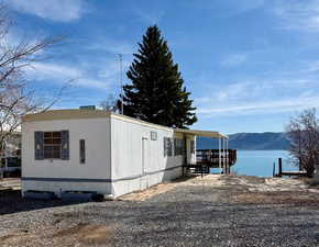Exterior space with a water and mountain view