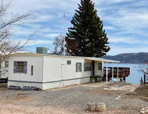 Manufactured / mobile home featuring central air condition unit and a mountain view