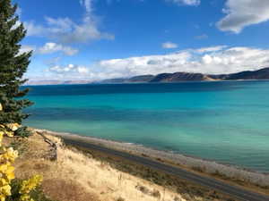 Property view of water featuring a mountain view and a view of the beach