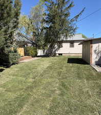 View of yard with an outdoor structure