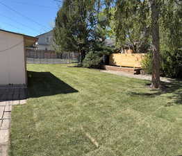 View of yard with fence