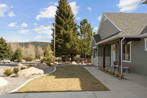 View of yard featuring a porch