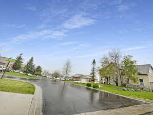 View of road with a residential view and curbs