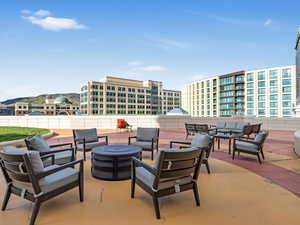 View of patio / terrace with an outdoor living space with a fire pit
