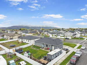 Drone / aerial view featuring a mountain view and a residential view