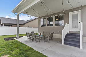 View of patio featuring fence