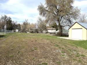 View of back pasture and detached garage