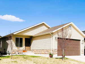 Rambler with Fully Finished Basement, Attached Garage, Concrete Driveway, and Stone Siding
