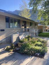 View of front of house featuring brick siding and a mountain view