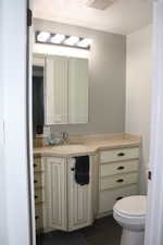 Bathroom with visible vents, tile patterned floors, vanity, and toilet