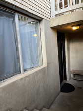Property entrance with a balcony