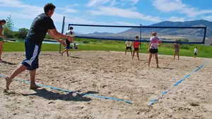 View of community with volleyball court and a mountain view picture courtesy of Saratoga Springs HOA