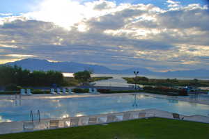 Pool with a water and mountain view picture courtesy of Saratoga Springs HOA