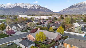 Birds eye view of property with a mountain view and a residential view