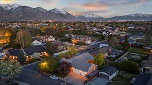 Aerial view at dusk with a residential view and a mountain view