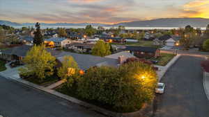 Aerial view at dusk featuring a residential view and a mountain view