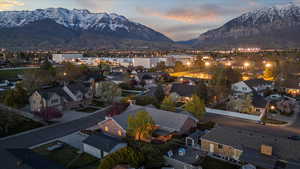 Aerial view at dusk with a residential view and a mountain view