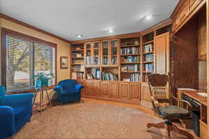 Living area featuring light wood-style flooring, recessed lighting, and ornamental molding