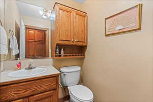 Bathroom featuring vanity and toilet
