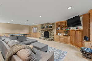 Living area with wainscoting, carpet floors, wooden walls, and recessed lighting