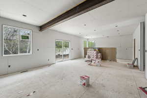 Unfurnished living room featuring visible vents