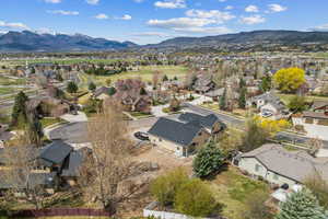 Drone / aerial view with a mountain view and a residential view
