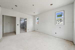 Unfurnished bedroom featuring ensuite bathroom