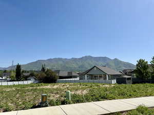 View of mountain background featuring nearby suburban area