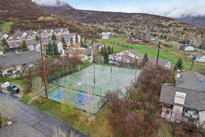 Birds eye view of property with a mountain view and a residential view