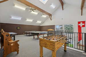 Game room with ceiling fan, carpet floors, lofted ceiling with beams, and pool table