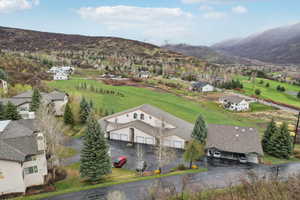 Birds eye view of property with a mountain view and a residential view