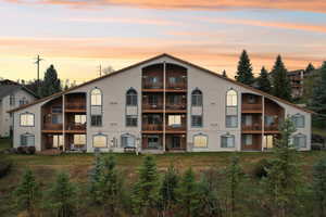View of property at dusk