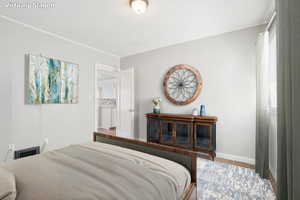 Carpeted bedroom with baseboards