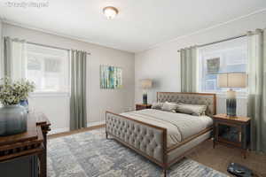 Bedroom featuring baseboards and carpet floors