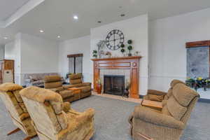 Clubhouse  with a tile fireplace, recessed lighting, and a wainscoted wall