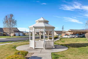 View of home's community featuring a lawn, a gazebo, and a residential view