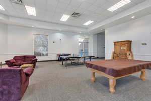 Clubhouse Rec room featuring visible vents, carpet flooring, pool table, and a drop ceiling