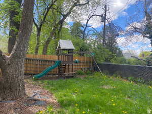 View of play area featuring a fenced backyard